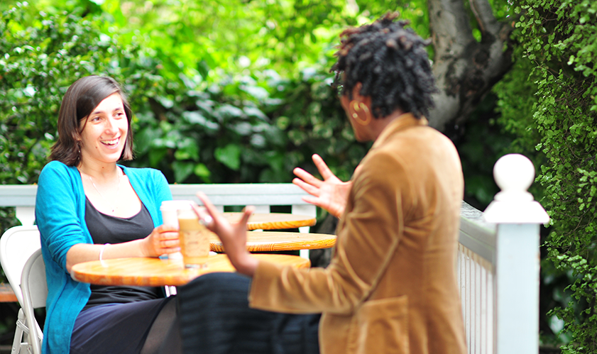 two women faculty talking